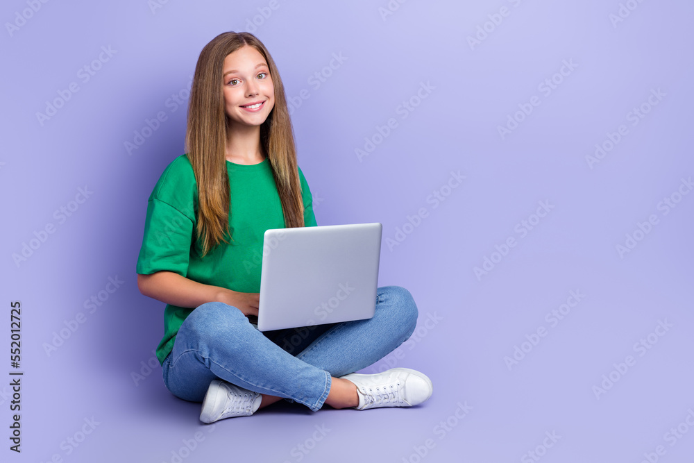 Photo of lovely pretty cute lady sitting floor hold netbook macbook learning home empty space isolated on purple color background Photo of lovely pretty cute lady sitting floor hold netbook macbook learning home empty space isolated on purple color background