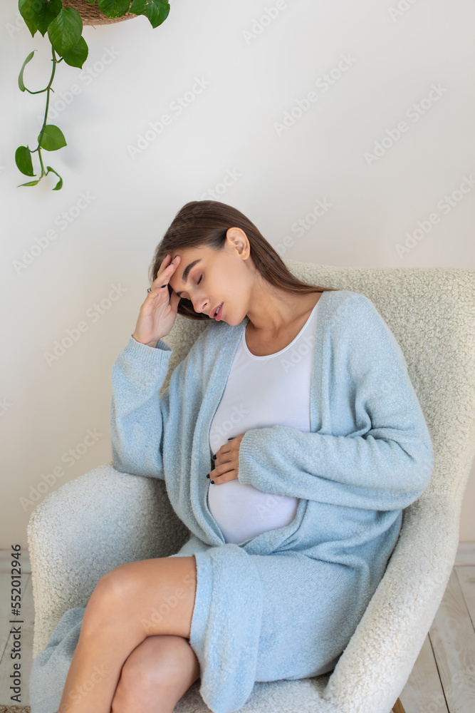 Young pregnant woman having a headache Young pregnant woman having a headache