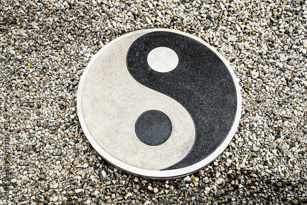 Yin Yang symbol on natural water stones background Yin Yang symbol on natural water stones background
