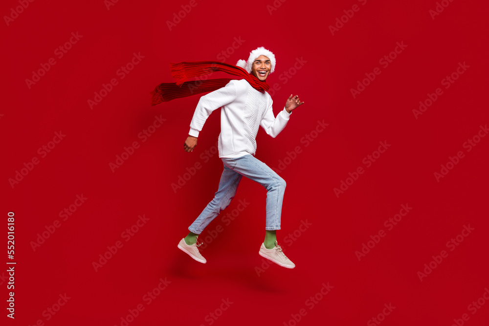 Full length profile photo of crazy active person running jumping isolated on red color background Full length profile photo of crazy active person running jumping isolated on red color background