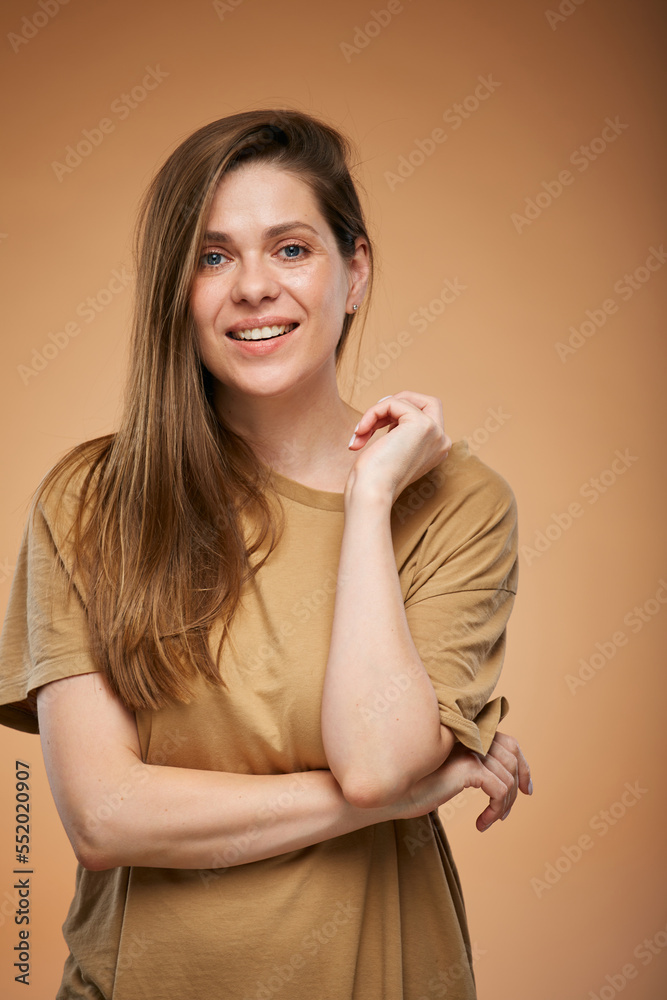 Obraz premium Smiling woman with long hair in brown home male shirt. Isolated female portrait.