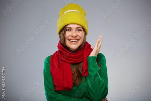 Smiling woman in casual warm clothes. Advertising female studio portrait.