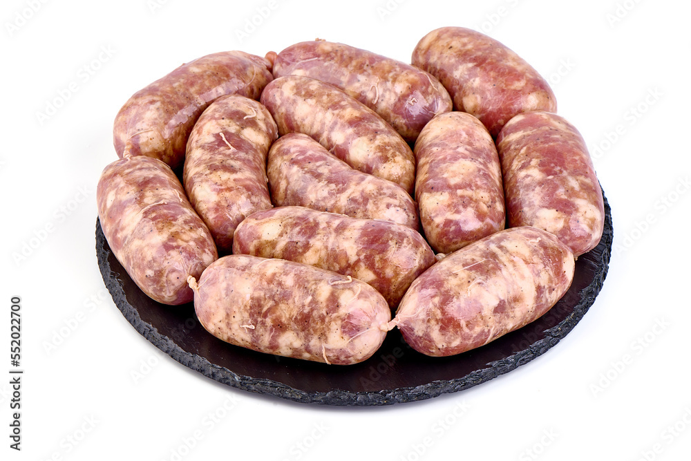 German Oktoberfest Sausages with basil leaf, close-up, isolated on white background. German Oktoberfest Sausages with basil leaf, close-up, isolated on white background.