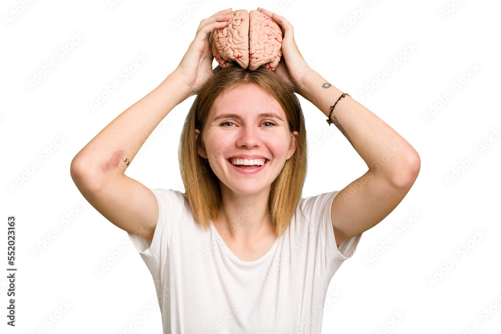 Young caucasian woman holding a brain isolated Young caucasian woman holding a brain isolated