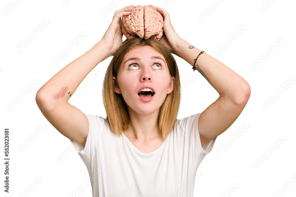 Young caucasian woman holding a brain isolated Young caucasian woman holding a brain isolated