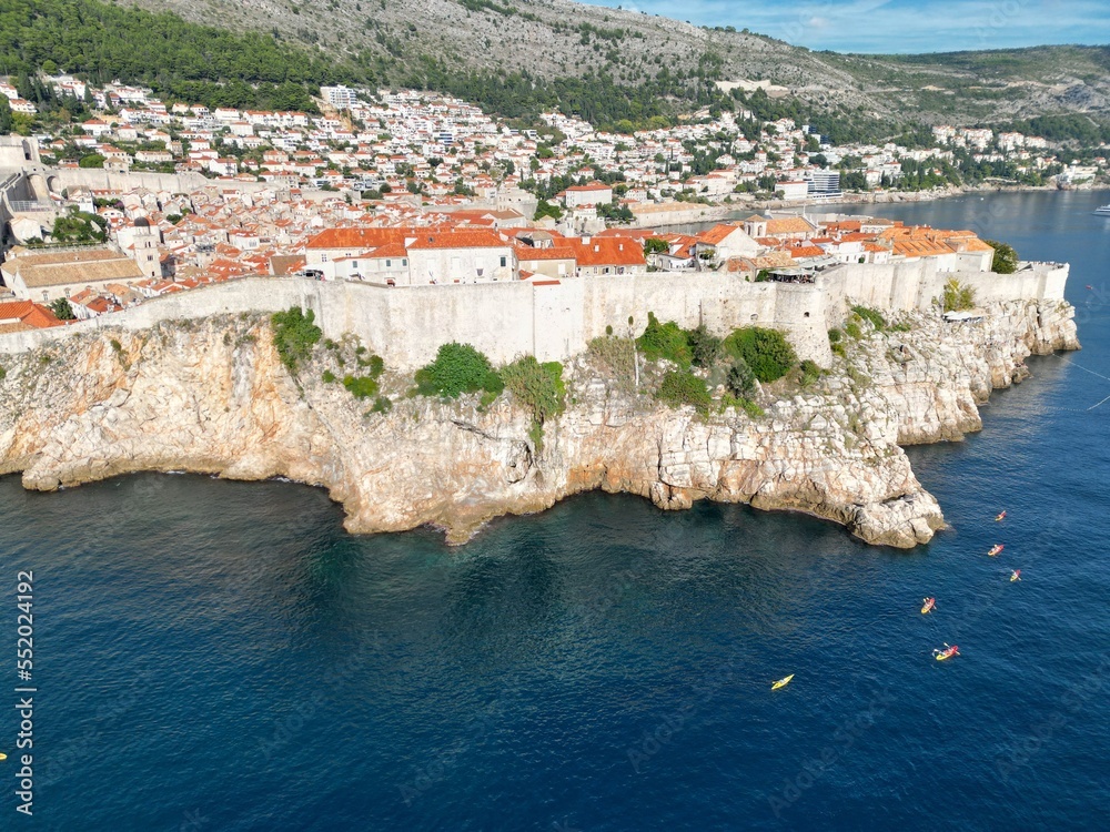 Dubrovnik Croatia walled town drone aerial view sunny day blue sky..
