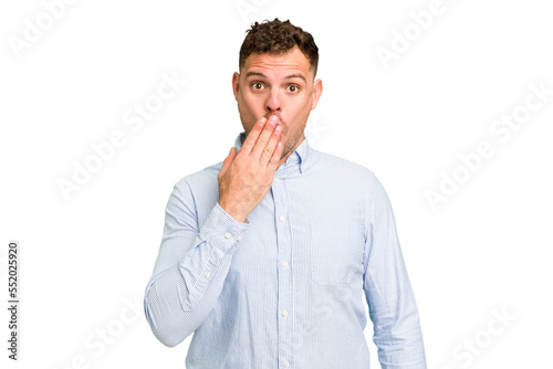 Young caucasian handsome man isolated shocked, covering mouth with hands, anxious to discover something new.
