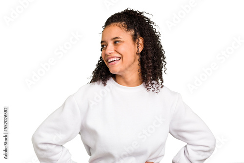 Young Brazilian curly hair cute woman isolated confident keeping hands on hips. photo