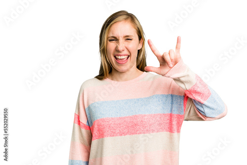 Young caucasian woman cutout isolated showing a horns gesture as a revolution concept.