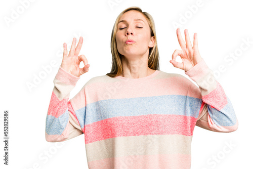 Young caucasian woman cutout isolated relaxes after hard working day, she is performing yoga.