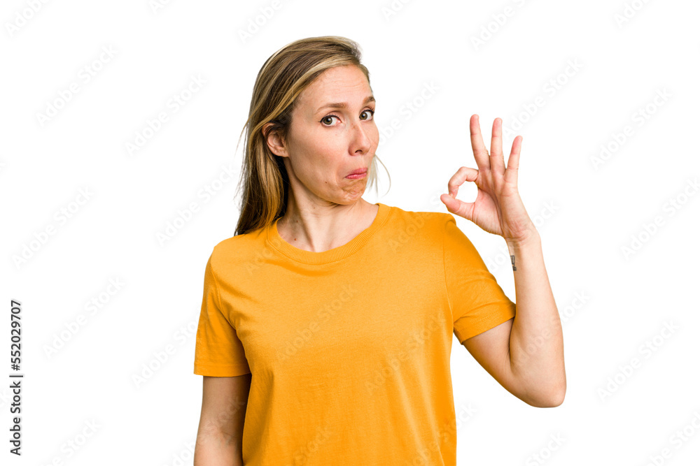 Young caucasian woman cutout isolated winks an eye and holds an okay gesture with hand. Young caucasian woman cutout isolated winks an eye and holds an okay gesture with hand.