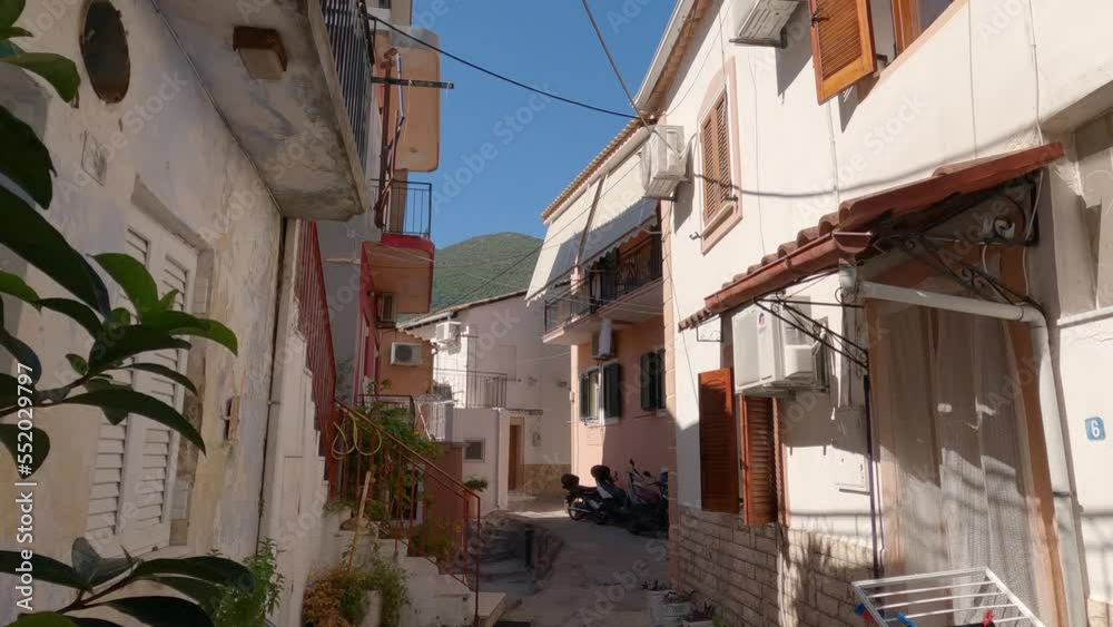 static shot of a quiet residential street with a slight breeze in Parga, Greece