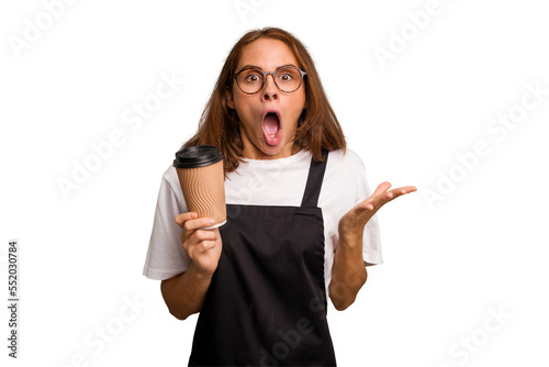 Young caucasian woman holding takeaway coffee isolated surprised and shocked.