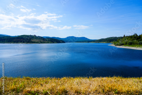 View of the Grane reservoir with the surrounding nature near Goslar. Landscape at the Granetalsperre in the Harz Mountains. 