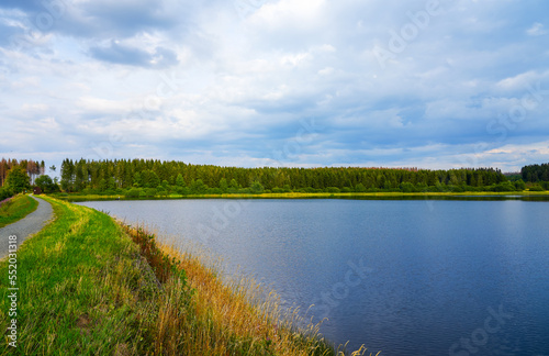 Hirschler pond near Clausthal-Zellerfeld in the Harz Mountains. Landscape with a small lake and idyllic nature.
 photo