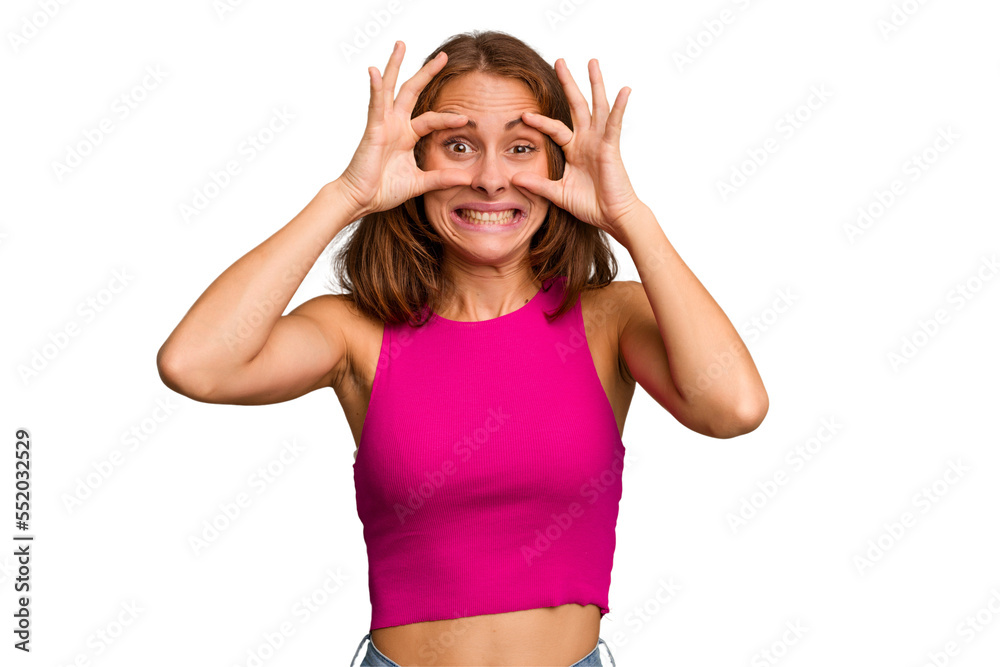 Young caucasian woman isolated keeping eyes opened to find a success opportunity.
