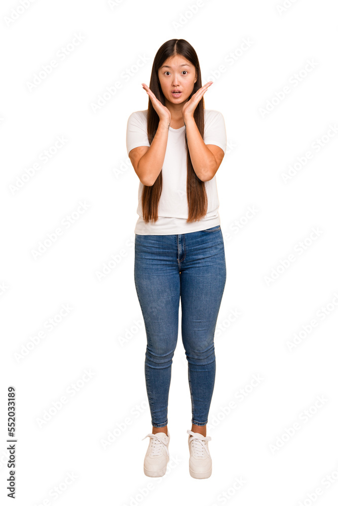 Young asian woman standing, full body cutout isolated surprised and shocked. Young asian woman standing, full body cutout isolated surprised and shocked.