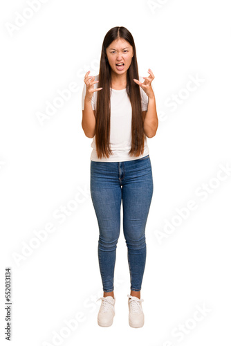 Young asian woman standing, full body cutout isolated screaming with rage.