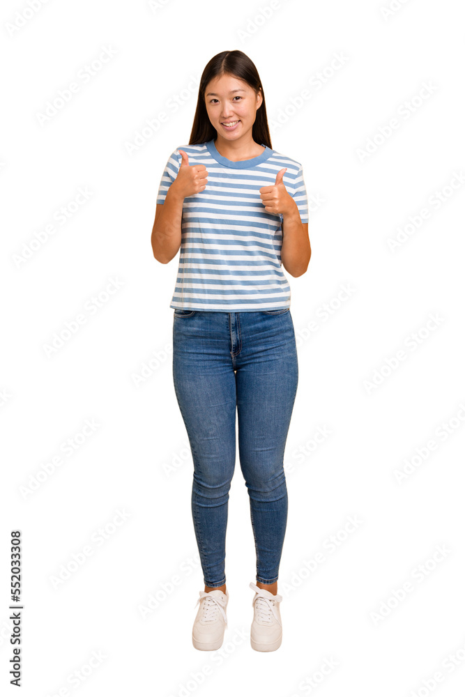 Young asian woman standing, full body cutout isolated raising both thumbs up, smiling and confident. Young asian woman standing, full body cutout isolated raising both thumbs up, smiling and confident.
