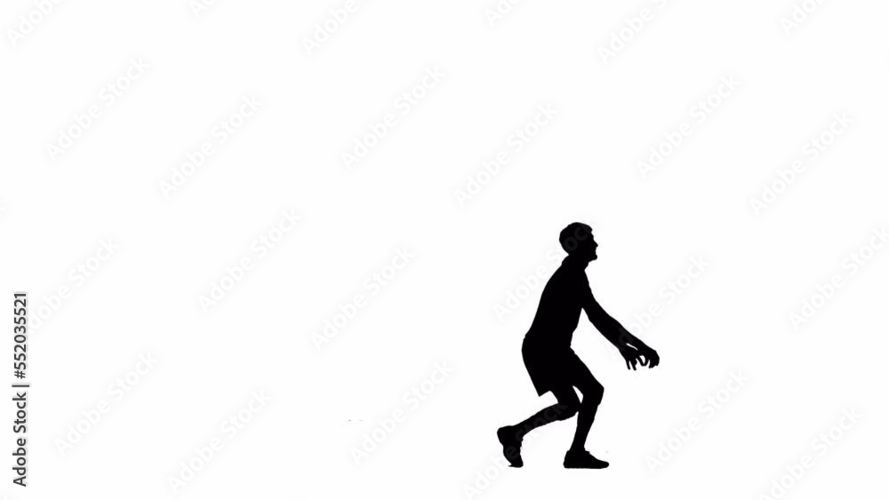 Black silhouette of young male athlete bounces and hits ball with his hand. Practicing ball handling skills in volleyball. Man trains in studio on white isolated background, full length. Black silhouette of young male athlete bounces and hits ball with his hand. Practicing ball handling skills in volleyball. Man trains in studio on white isolated background, full length.