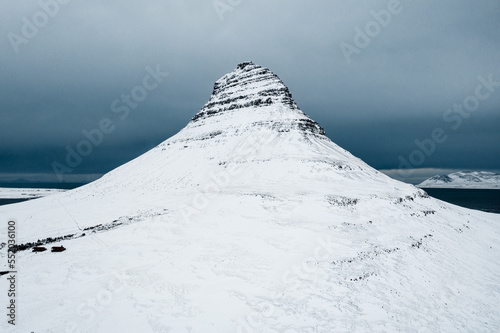 Kirkjufell, Church Mountain, Iceland's Snfellsnes Peninsula covered by snow during winter,a mountain rising above the sea photo