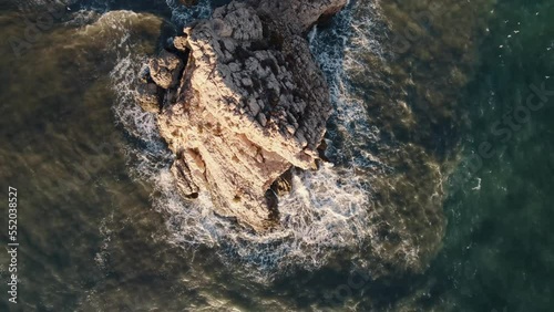 Drone head shot of Waves Crashing Rocks. Peñón, offshore rocky island fortress. 