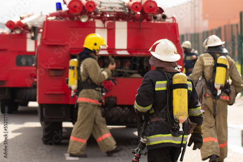 A brigade of firefighters deploys equipment for tasks