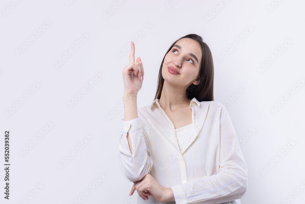 Happy young caucasian female in a shirt pointing fingers away Happy young caucasian female in a shirt pointing fingers away