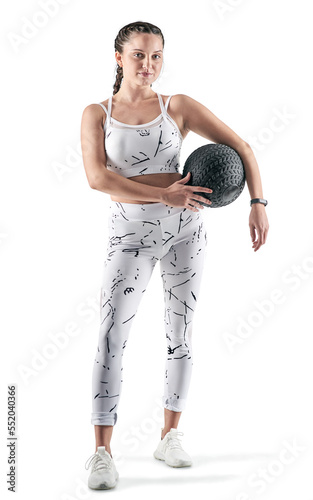 PNG studio portrait of a sporty young woman holding an exercise ball.