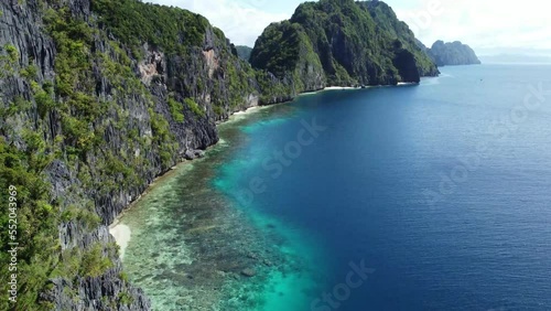 A canyon of limestone cliffs, filled with crystal clear water. A flight threw this mindblowing scenery in the Philippines. photo