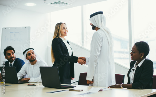 Photography Multiethnic western and middle eastern business team working together in an office of Dubai