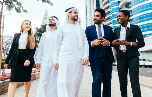 Photography Multiethnic western and middle eastern business team working together in an office of Dubai