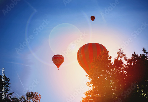 balloons against the setting sun photo