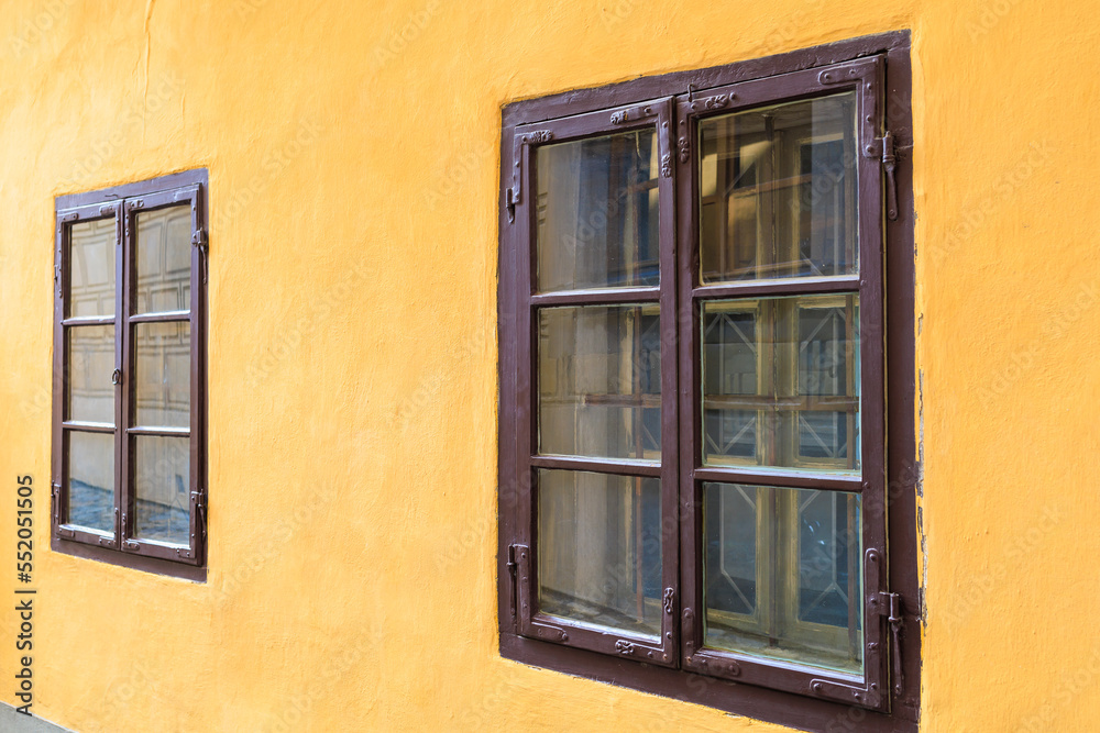Windows of an old historic building. Architectural travel background with selective focus