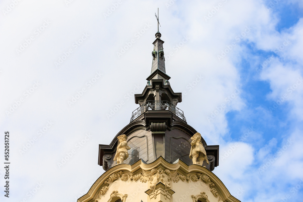 Spire of an old classical building. Background with selective focus