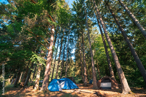 View of tourist tents. The Carpathian mountains are in the background. A wonderful warm summer morning, the concept of freedom and travel. Tereblya, Ukraine photo