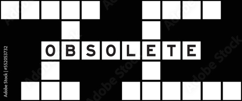 Alphabet letter in word obsolete on crossword puzzle background
