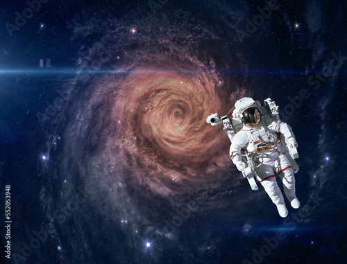 Fototapeta Naklejka Na Ścianę i Meble -  Astronaut and alien spiral galaxy. This image elements furnished by NASA.