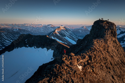 Aerial Overview of Climbers on peak in Swedish Lapland during the midnight sun, Kebnekaise, Sweden photo