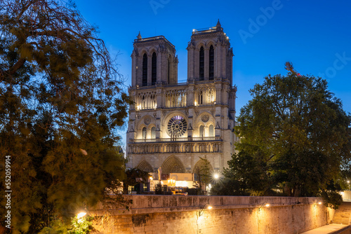 Notre Dame Cathedral in Paris by the Seine River at dawn, France