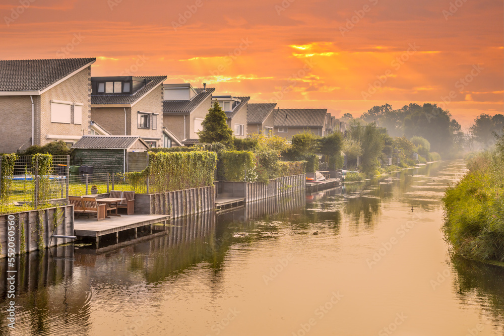 Fototapeta premium Homes on water edge in residential area