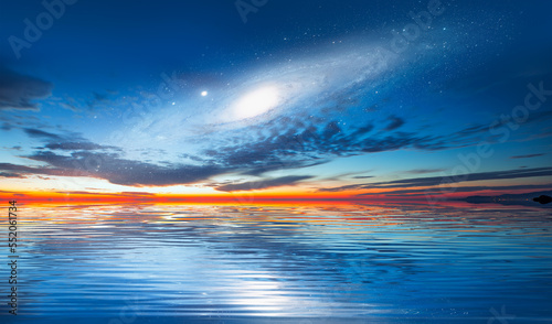 Andromeda Galaxy over the sea with sunset reflection on the sea "Elements of this image furnished by NASA"