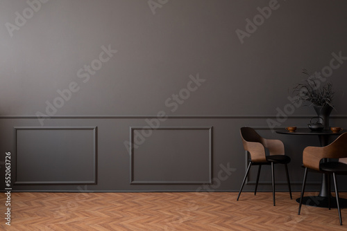Fototapeta Naklejka Na Ścianę i Meble -  Minimalist composition of living room interior with copy space, dark wall with stucco, stylish chair, round table, plants, wooden panels floor and personal accessories. Home decor. Template.