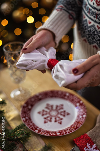 Wallpaper Mural Young girl setting up dining table decorated for Christmas Torontodigital.ca