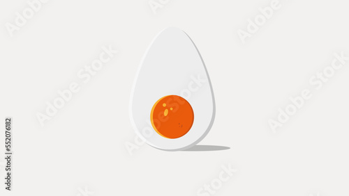 Single whole white egg and halved boiled egg with yolk