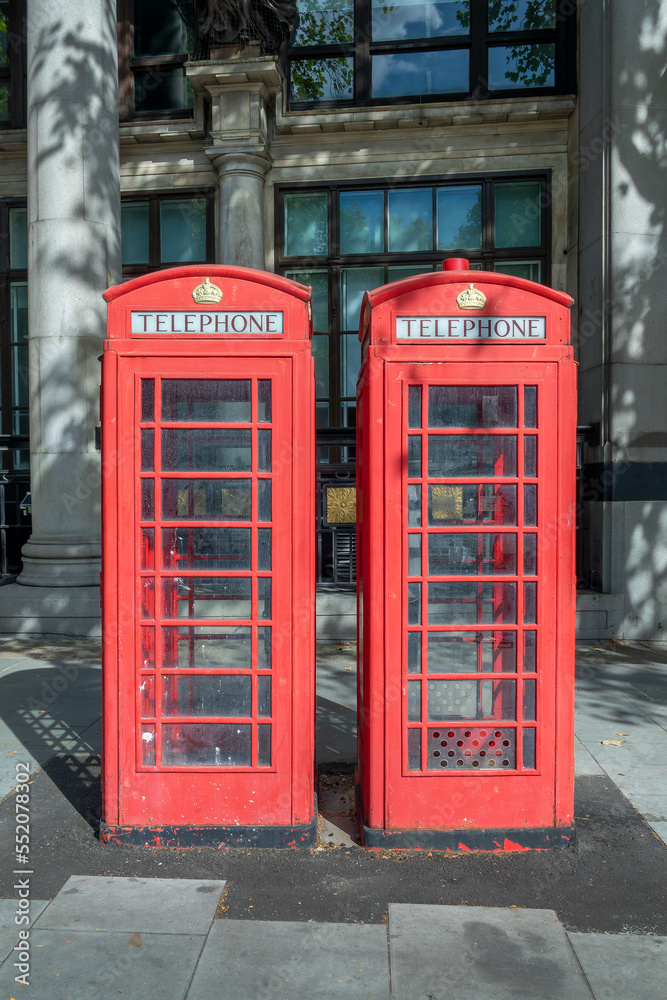 Two red classic british phone boxes in London, UK Two red classic british phone boxes in London, UK