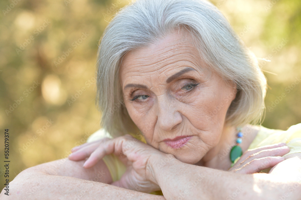 portrait of a beautiful sad old woman in summer portrait of a beautiful sad old woman in summer