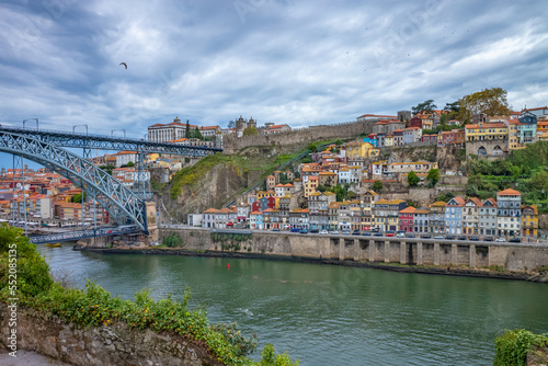  Old town skyline and Dom Luis bridge on the Douro River. Portugal. © borisbelenky
