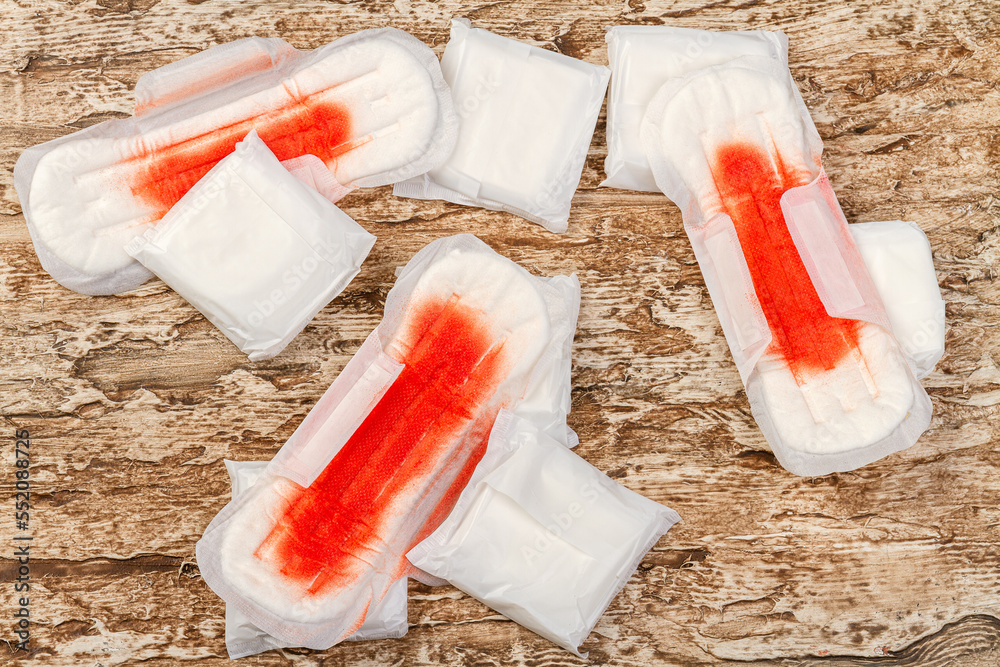 Pile of used sanitary pads with blood. Menstruation and feminine