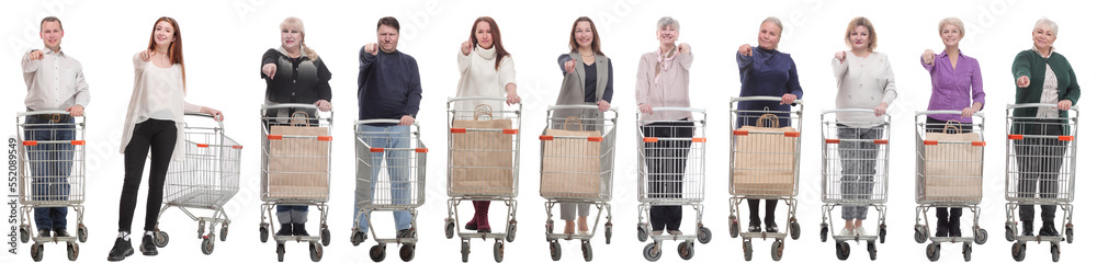 group of people with shopping cart showing thumbs up at camera group of people with shopping cart showing thumbs up at camera